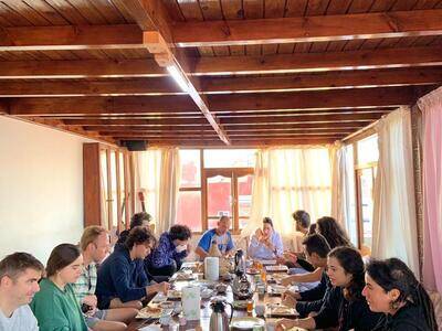 Guests enjoying Moroccan breakfast on the ocean-view rooftop terrace at Original Surf Morocco in Tamraght
