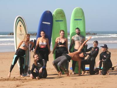 Surfers on the beach ready to hit the waves in Agadir with Original Surf Morocco